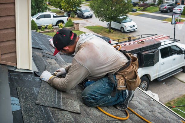 Professional Roofing technician working in Rowland, NC